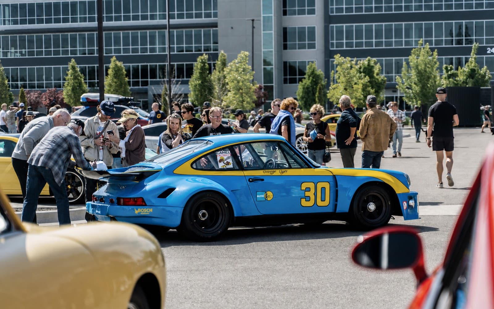 Classic sports car parked outdoors at an automotive gathering