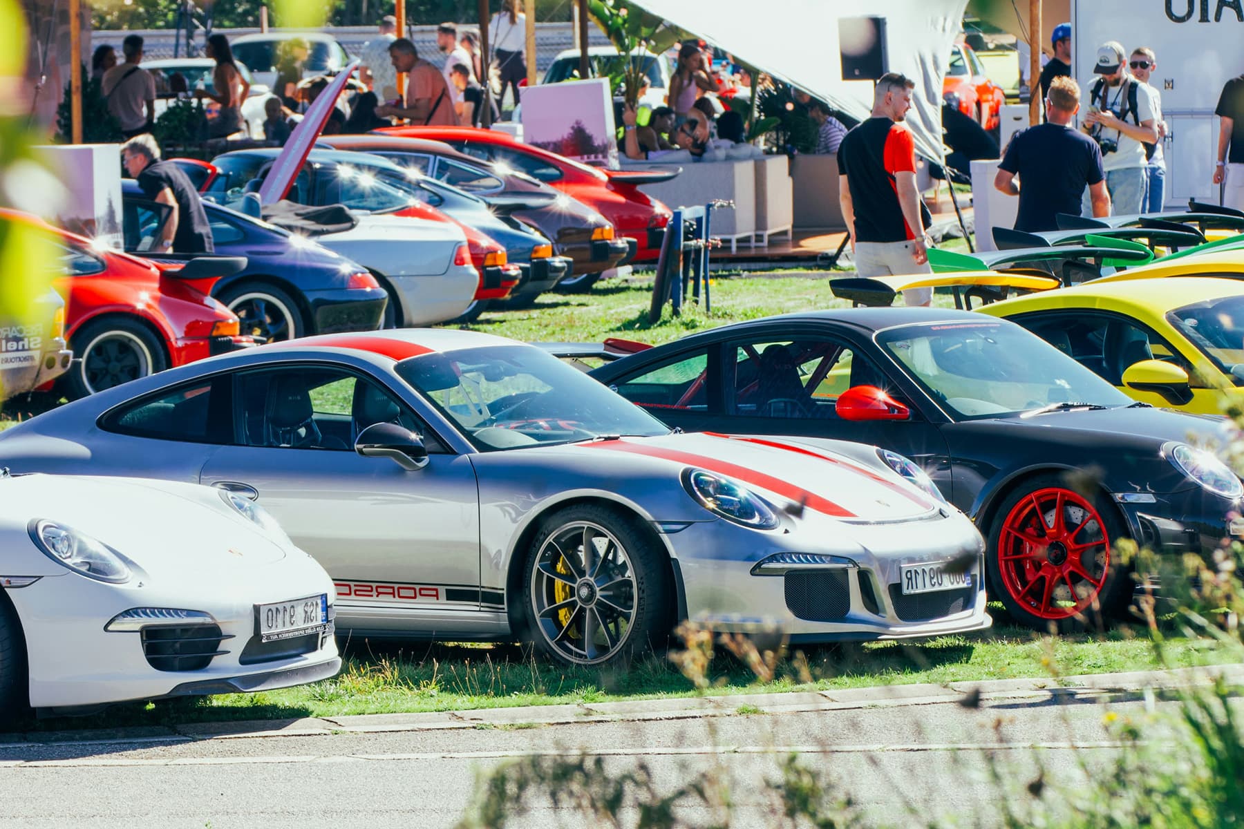Cars and attendees gathered at a car meet
